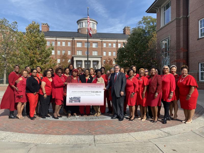 Zeta Psi Chapter of Delta Sigma Theta Sorority Presenting a Check