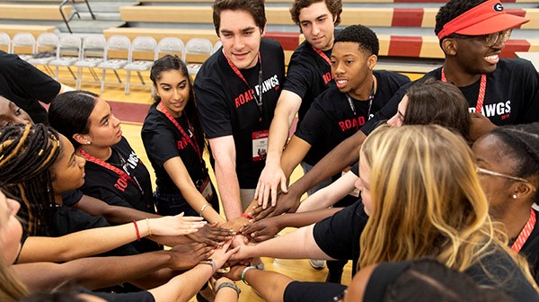 Students from Road Dawgs Program with Hands In